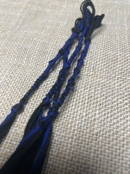 Hand-woven 100% cotton blue & black tassels display up close by The Family of Yah
