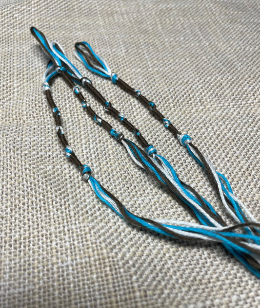 Dark brown tzitzit tassel with blue cord detail by The Family of Yah