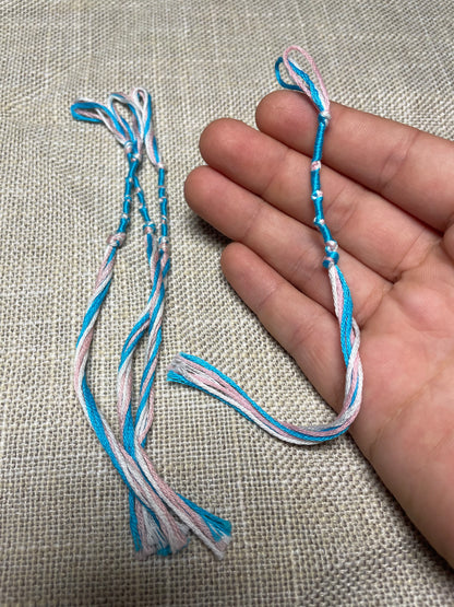 Tzit-zit tassel shown – blue & pink by the Family of Yah