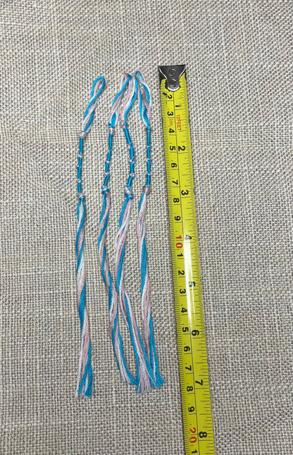 Tzit-zit tassel shown – blue & pink beside ruler for sizing  by the Family of Yah