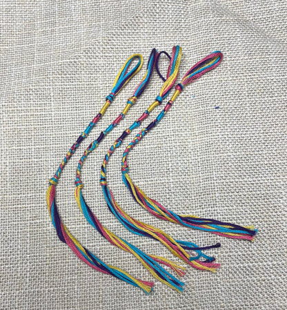 Four-piece multi-color tzit-zit set displayed flat – vibrant colors by the Family of Yah