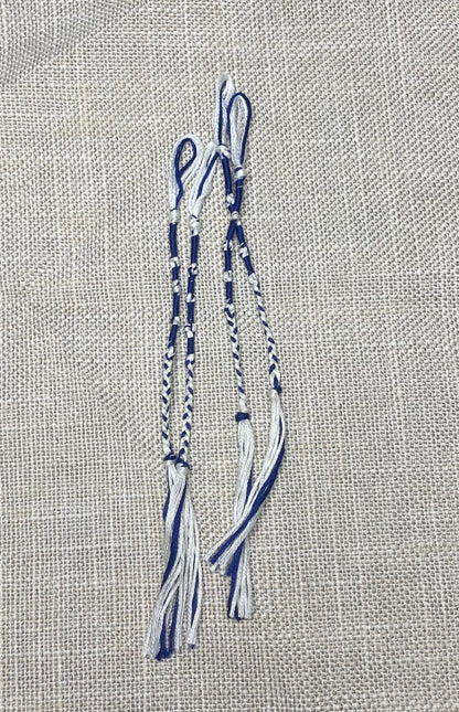 Four-piece tzit-zit set displayed on beige background by The Family of Yah