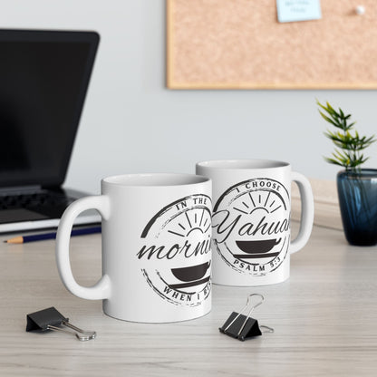 In the Morning when I rise, I choose Yahuah Psalm 5:3 coffee Mugs display on desk with Laptop, paperclips, cork board in the foreground and backgeround.