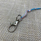 Swivel loop Clip, View of Clip attached to Tassel or Fringe, Tassel Clips, Tzit Tzit Clip Metallic Silver painted